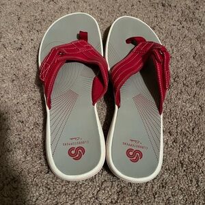 Clarke red flip flops